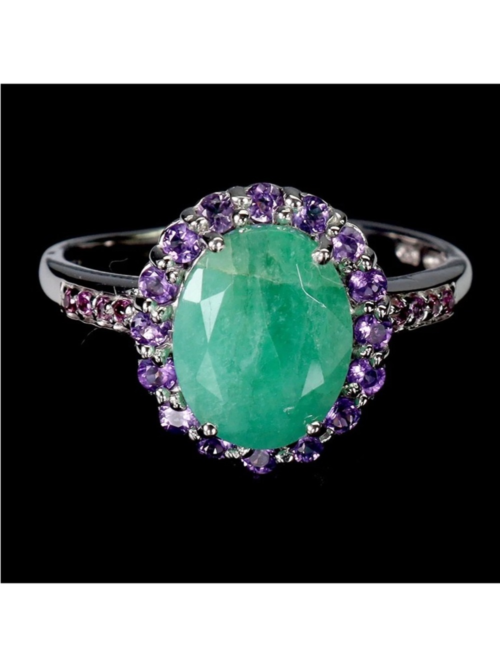Genuine 8 mm by 10mm Emerald- Halo Ring with Genuine Amethysts
See Video - Picture 4 of 7